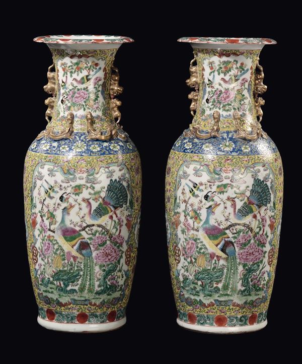 A pair of Famille Rose yellow-ground vase with birds and flowers within reserves and gilt dragons in relief, China, Qing Dynasty, 19th century