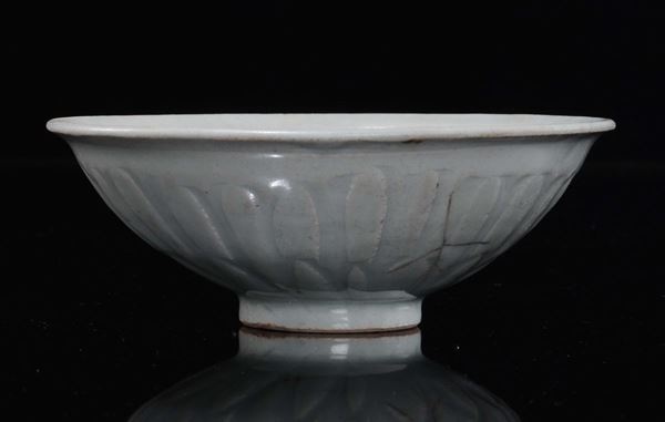 A Longquan Celadon porcelain bowl with embossed motif, China, Yuan Dynasty (1279-1368)