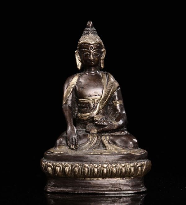 A small bronze Buddha figure seated on lotu flower, China, early 20th century