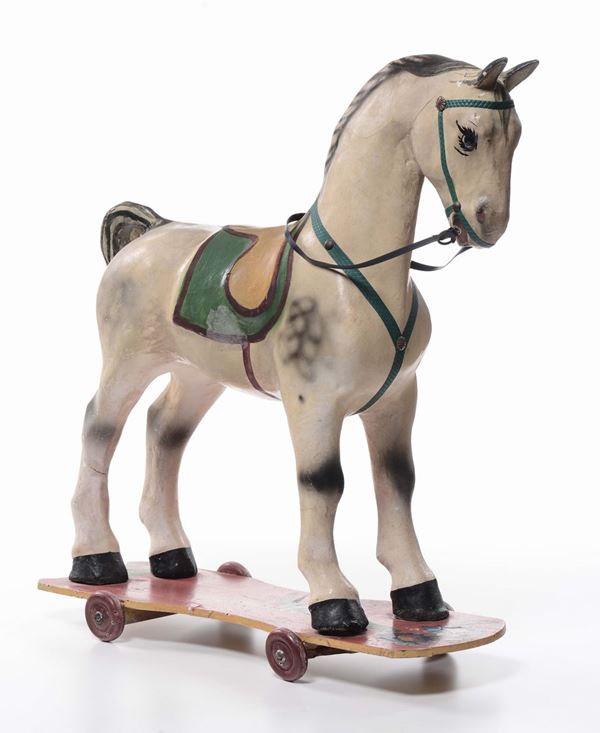 Cavallo a rotelle in legno dipinto in policromia