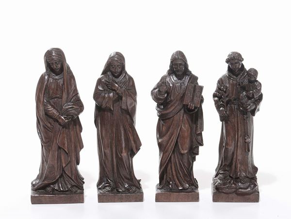 Quattro sculturine in legno intagliato raffiguranti Santi