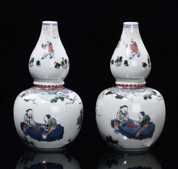 A pair of double-pumpkin polychrome porcelain vases with figure, China, Qing Dynasty, 19th century