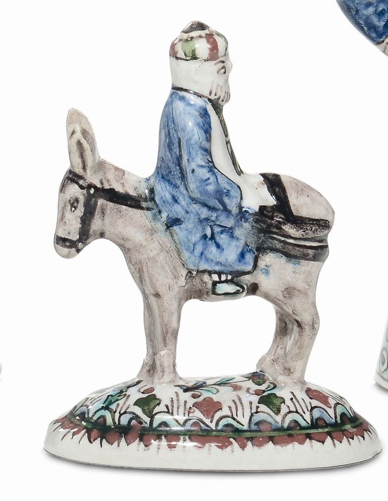 Gruppo in terraglia raffigurante asinello con contadino,Kuthaya (?) inizi XIX secolo  - Asta Antiquariato, Affidamenti da raffinate dimore private - Cambi Casa d'Aste
