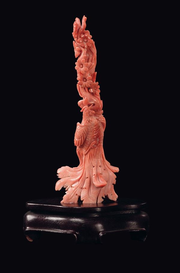 A phoenix and peach flowers carved coral, China, Qing Dynasty, late 19th century