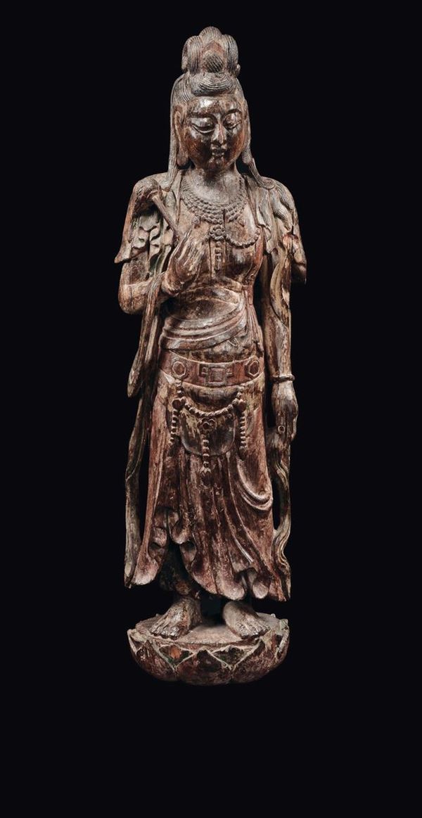 A large semi-lacquered wood Guanyin figure standing on a double lotus flower, China, Qing Dynasty, Qianlong Period (1736-1795)
