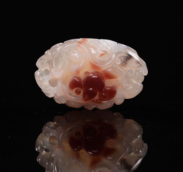 A carved agate group with small dragon between leaves, China, 20th century