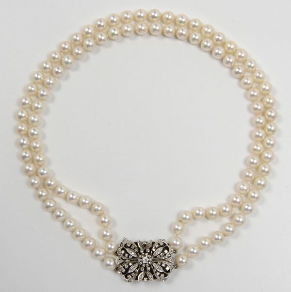 A two-row cultured pearl and diamond necklace