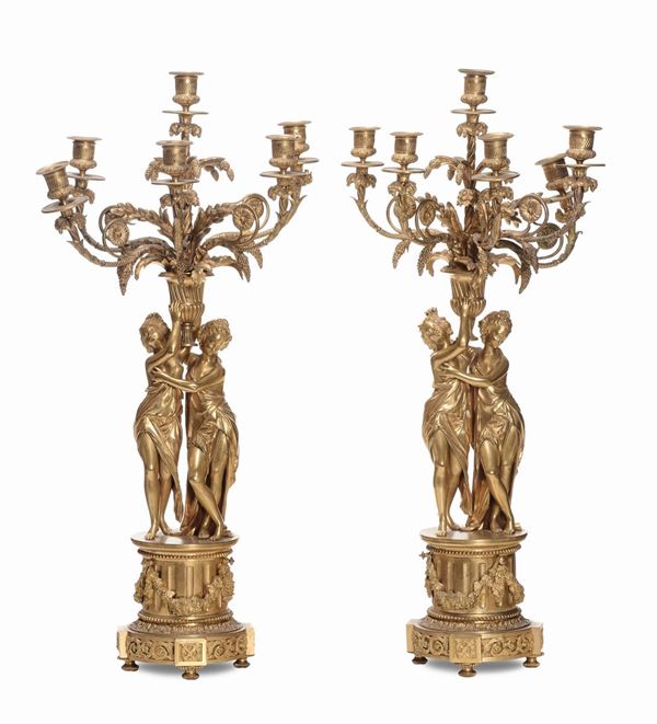 Coppia di grandi candelabri a sei luci in bronzo dorato, prima metà XIX secolo