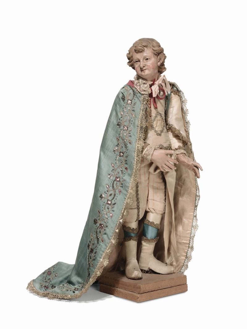 Paggio con mantello azzurro riccamente decorato, manifattura genovese, XVIII secolo, di tipologia analoga alle figure presenti nel presepe della chiesa di Sant’Anna e N.S. di Oregina  - Asta Sculture del Presepe Napoletano e Genovese - I - Cambi Casa d'Aste