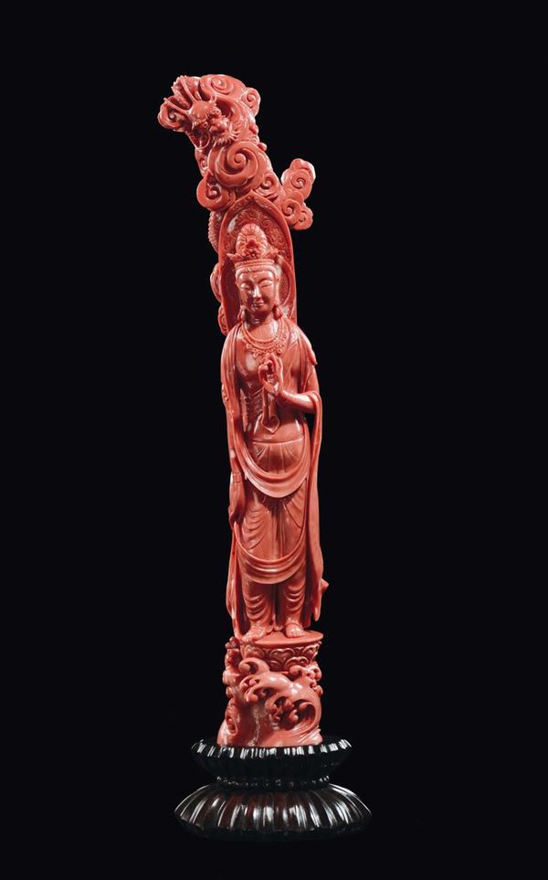 A carved coral Guanyin figure with aura and dragon, China, Qing Dynasty, late 19th century