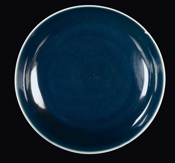 A monochrome blue porcelain dish with archaic style flower decoration, China, Qing Dynasty, 19th century