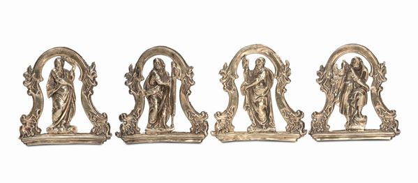 Four gilt bronze small plates representing Saints, 18th century