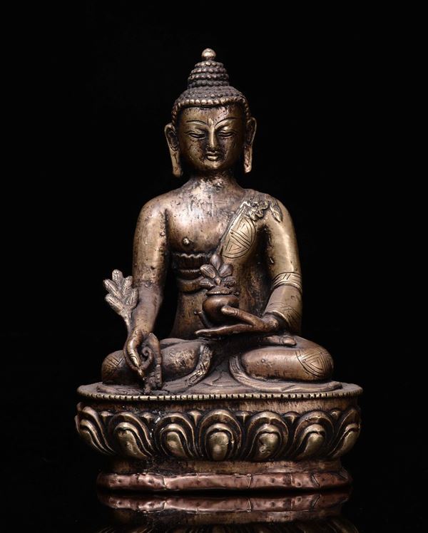 A repoussè copper Buddha seated on lotus flower with small vase on his hand, Tibet, 19th century