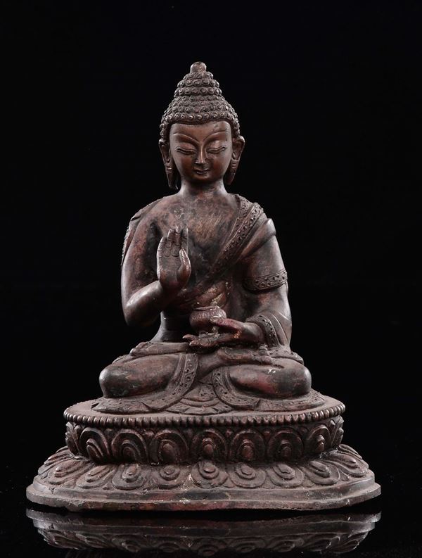 A copper Buddha seated on lotus flower, Tibet, 19th century