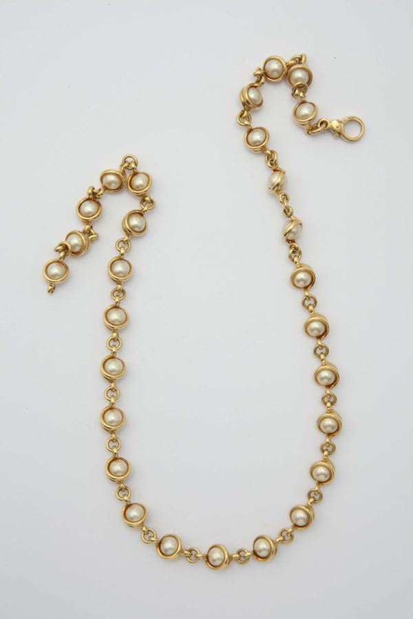 A gold and pearl necklace. Signed Pomellato