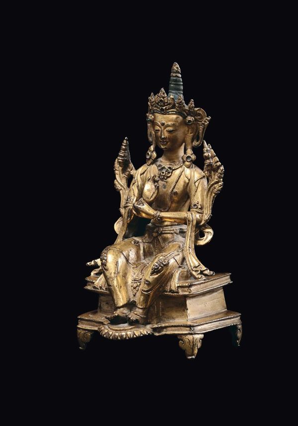 A gilt bronze seated Maitreya figure, Tibet, Ming Dynasty, 15th century