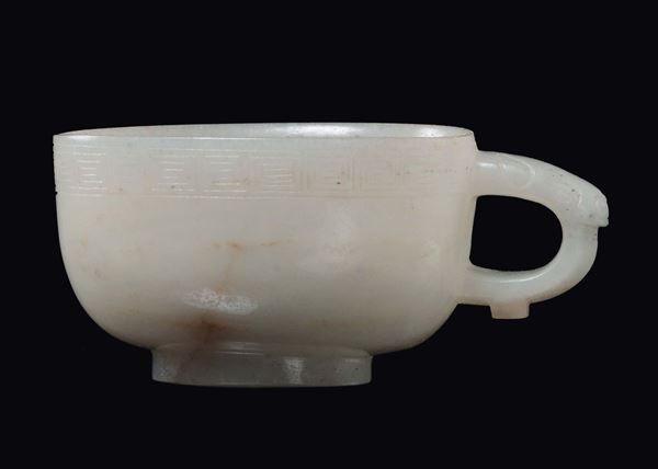 A small white jade cup with handle, China, Qing Dynasty, Qianlong Period (1736-1795)