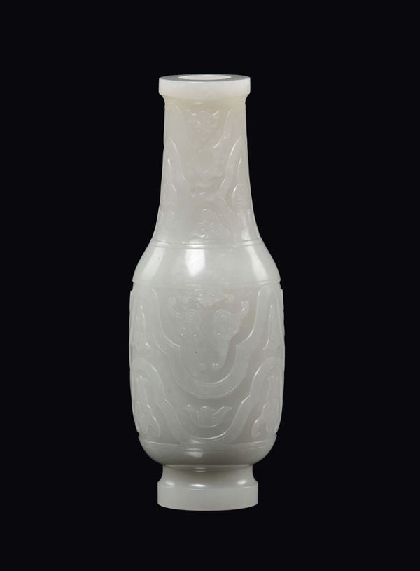 A small white jade vase carved with geometric flowers and motif in archaic style, China, Qing Dynasty, Qianlong Period (1736-1795)