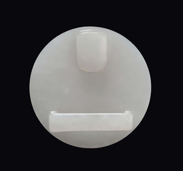 A white jade rounded buckle, China, Qing Dynasty, 19th century