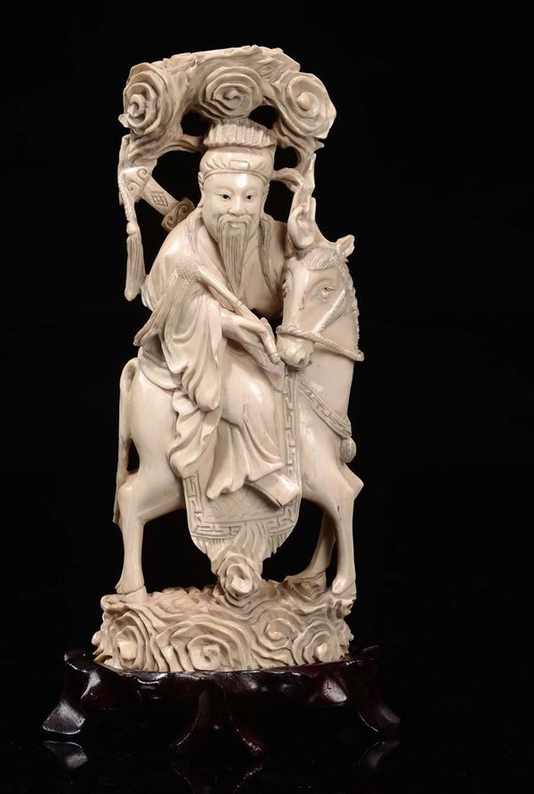 A carved ivory warrior with sword on horseback, China, Qing Dynasty, late 19th century