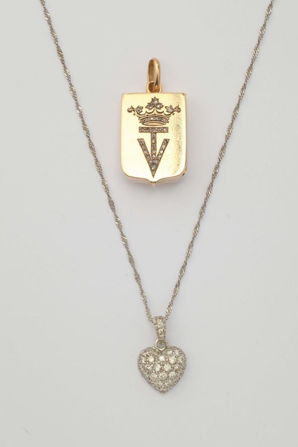 A lot of two gold and diamond pendent