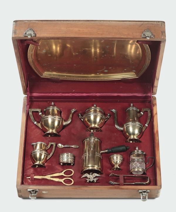 Servito da viaggio in argento dorato composto da dieci pezzi entro custodia in legno, argentiere Musy, Torino inizi del XX secolo