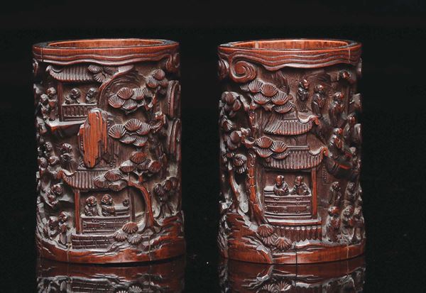 A pair of carved bamboo brushpots with landscape in relief, China, Qing Dynasty, 19th century