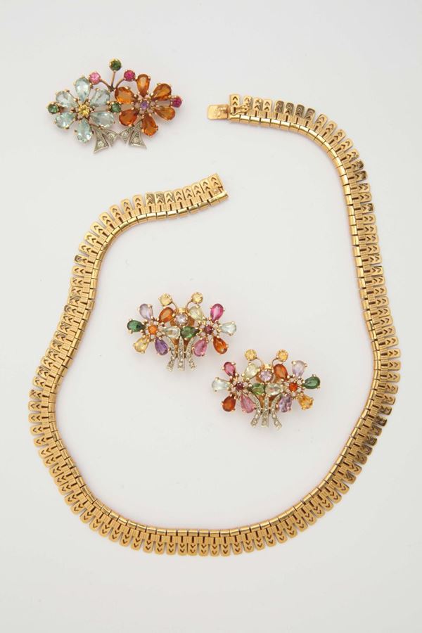 A group of gold necklace and tourmaline and gold brooch and a pair of earrings