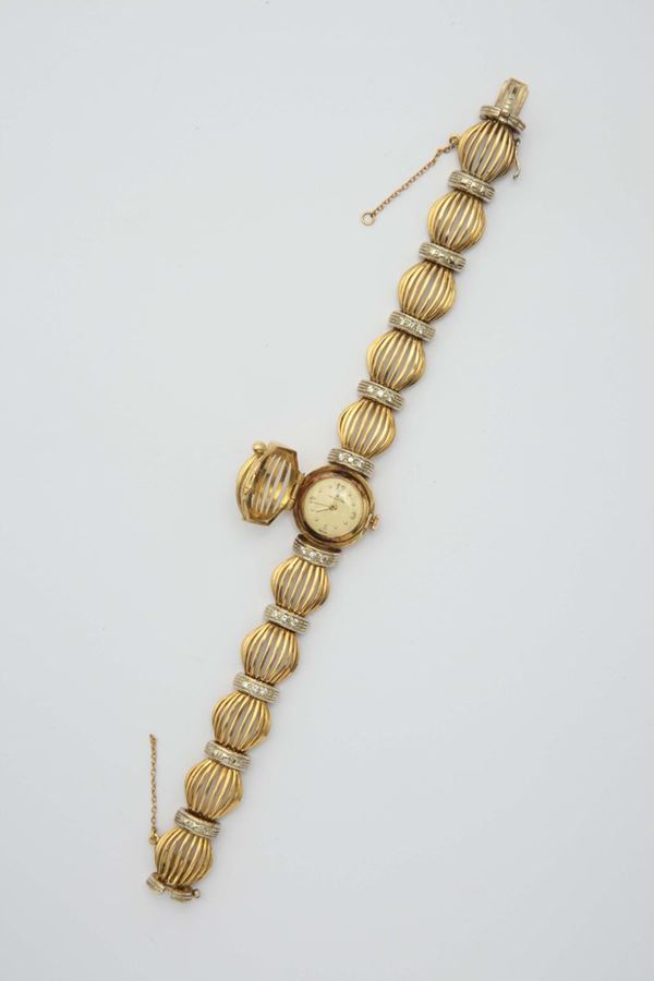 A diamond and gold ladies watch