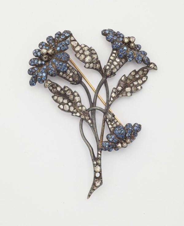 A diamond, sapphire and silver brooch