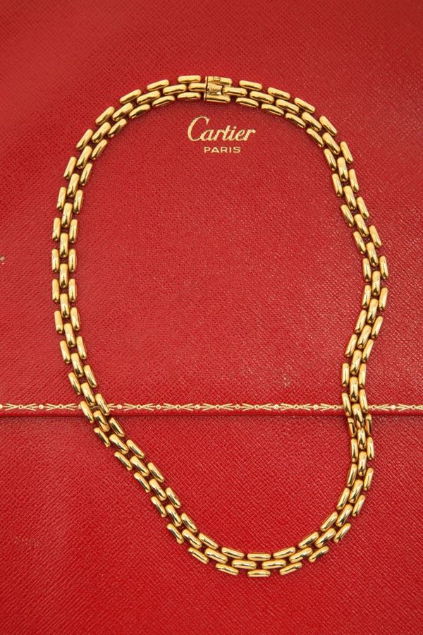 Cartier. A gold necklace. Accompanied by the original box and guarantee certificate.