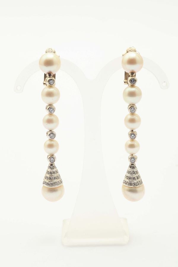 A pair of cultured pearl and diamond pendant earrings