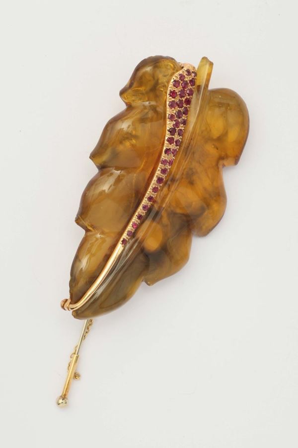 An amber and ruby brooch