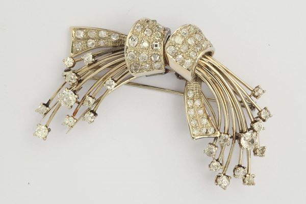 A double diamond and platinum clip brooch