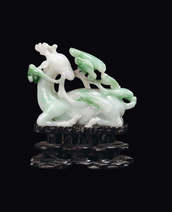 A green jade deer with branches in relief, China, Qing Dynasty, 19th century