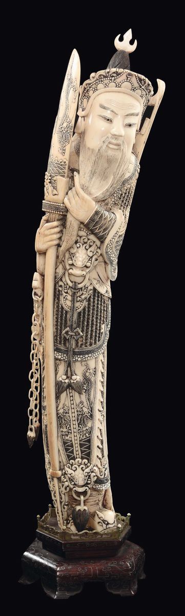 A carved ivory figure of warrior Guanyin with sword, spear, bow and arrows and mobile chain, China, Qing Dynasty, 19th century