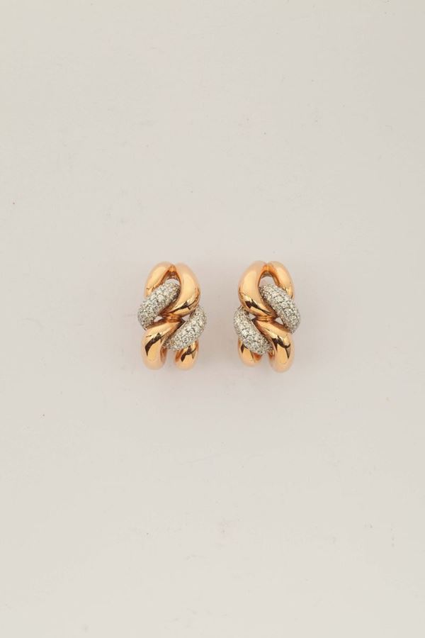 A pair of gold and diamond earrings