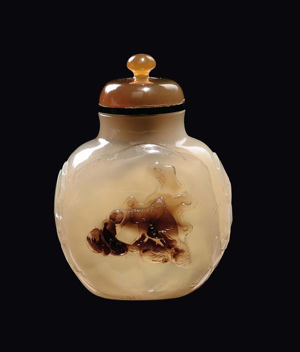 An agate snuff bottle with wise man and child in relief, China, Qing Dynasty, 19th century