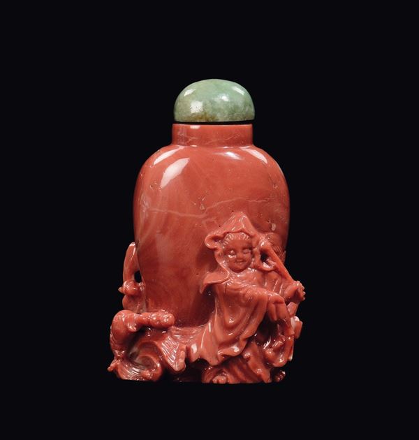 A carved coral snuff bottle with Guanyin and fish in relief, China, Qing Dynasty, late 19th century
