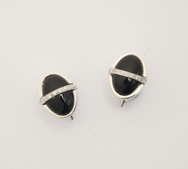 A pair of diamond, onix and gold cufflinks  - Auction Fine Jewels - I - Cambi Casa d'Aste