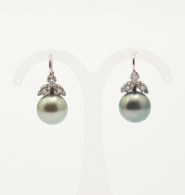 A pair of Tahiti pearls and diamond earrings