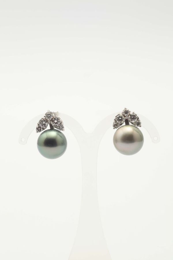 A pair of Tahiti pearls and diamond earrings