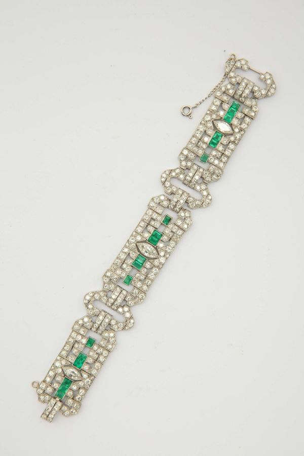 A diamond, emerald and platinum bracelet