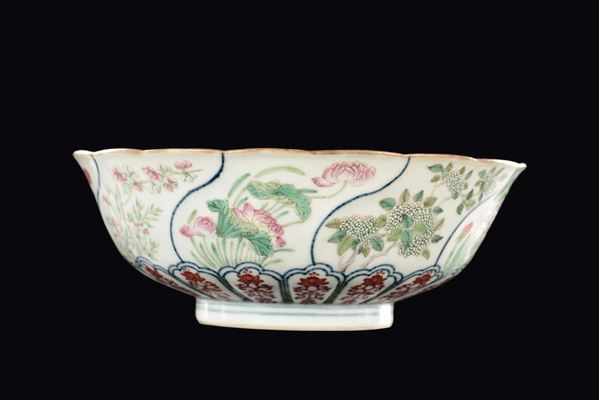 A Famille Rose cup with different type of flowers within reserves, China, Qing Dynasty, 19th century