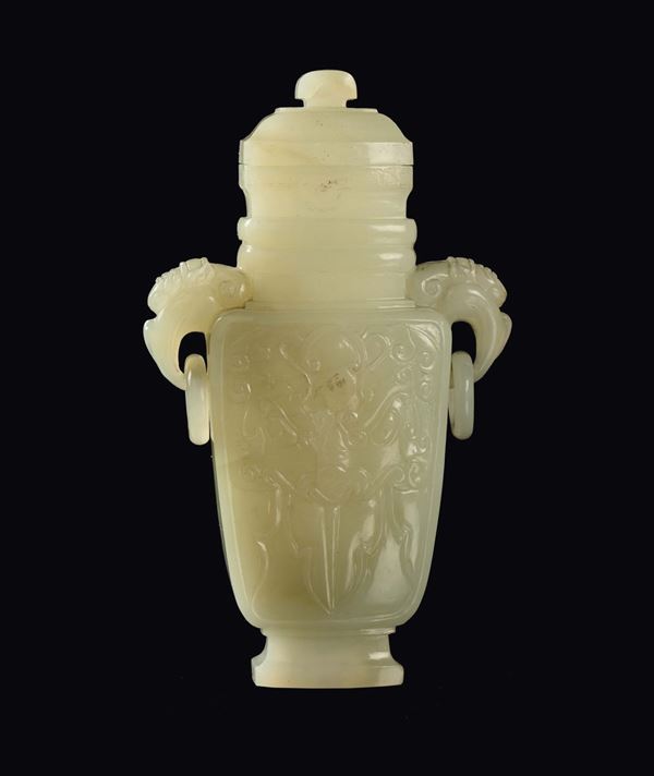 A Celadon white jade vase and cover with elephant handles, China, Qing Dynasty, 19th century