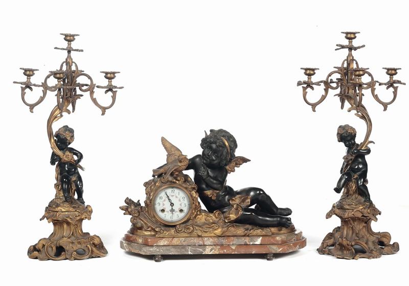 Trittico composto da orologio e coppia di candelieri, Francia XIX secolo  - Asta Fine Art Selection - II - Cambi Casa d'Aste