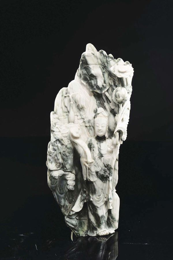 A jadeite group with Guanyin in relief, China, Qing Dynasty, 19th century