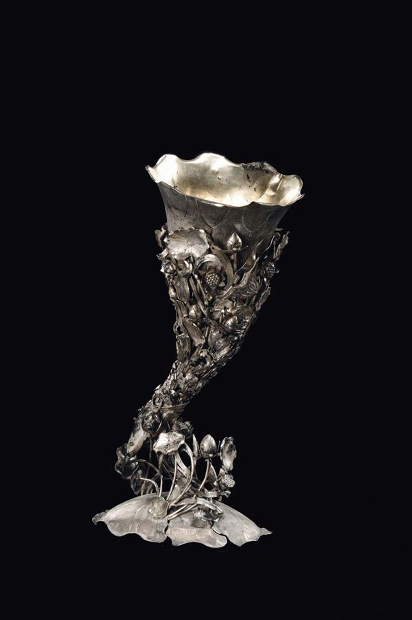 An embossed silver cornucopia rhino horn-shaped with floral decoration, China, Qing Dynasty, 19th century