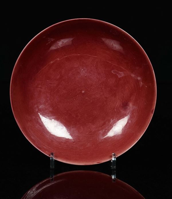 A monochrome red porcelain dish with cherry blossom, China, 20th century
