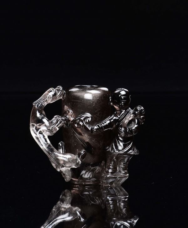 A smoky rock crystal small vases with child and dragon in relief, China, 20th century